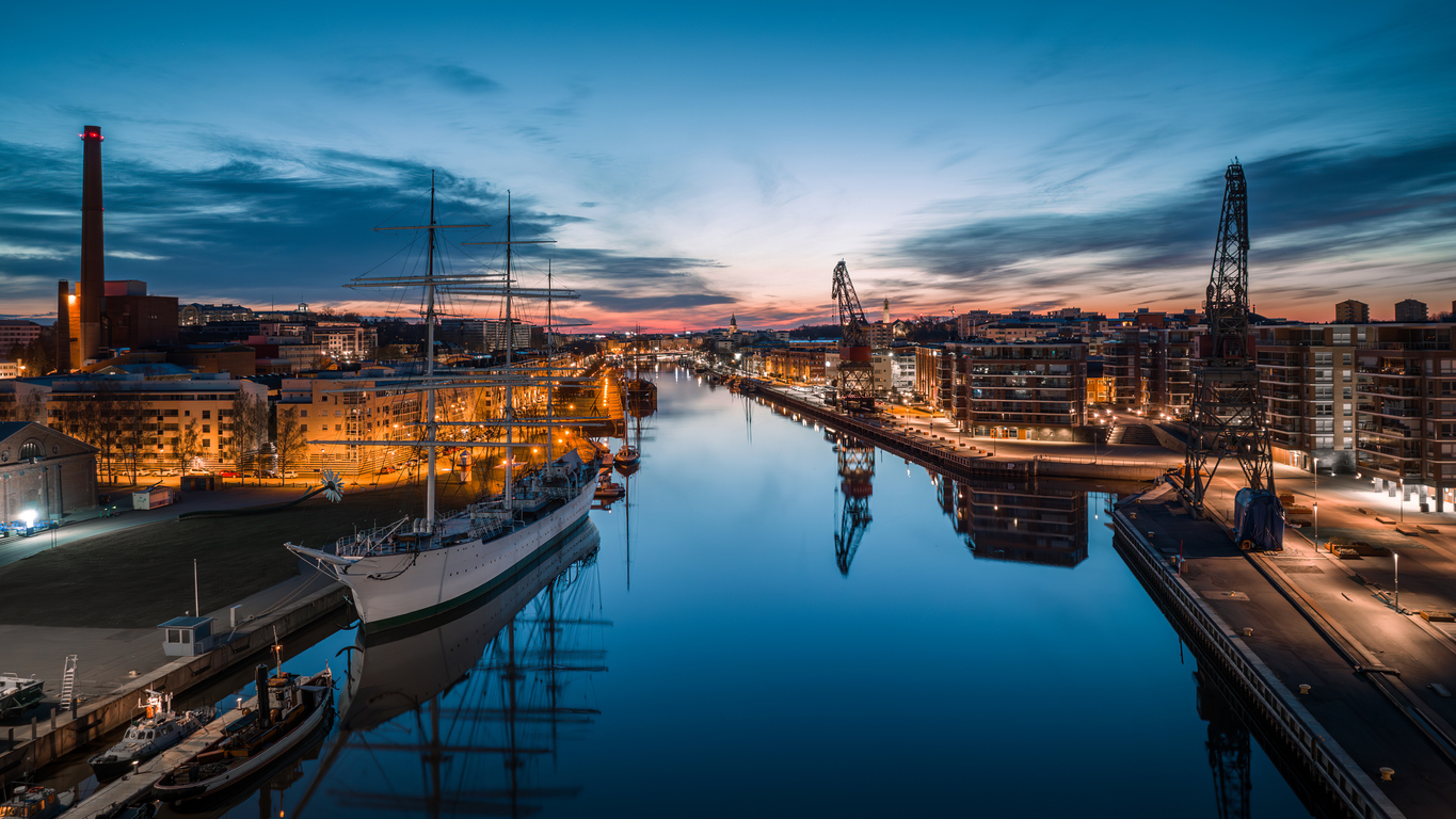 Aerial view of calm aurojoki river and Swan of Finland sailing ship at dawn in Turku, Finland